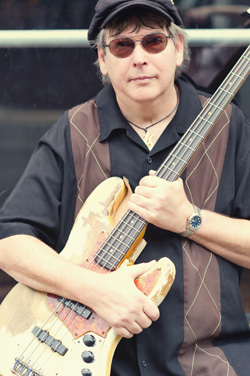 Tommy Shannon with guitar